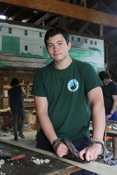 Sam working on his canoe paddle.