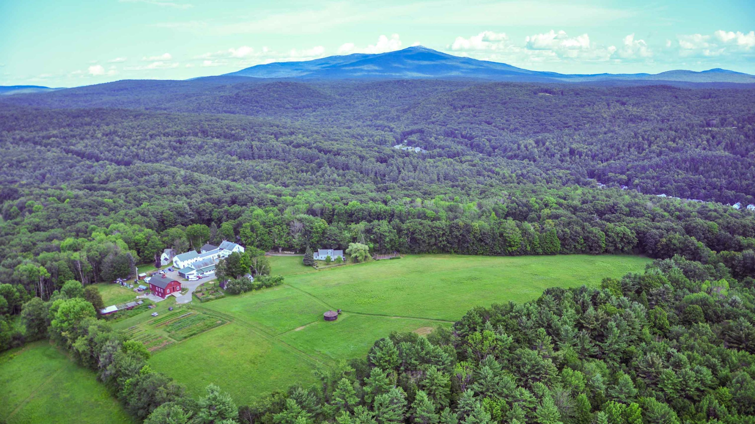 An aerial view of Glen Brook and the surrounding forests and mountains.