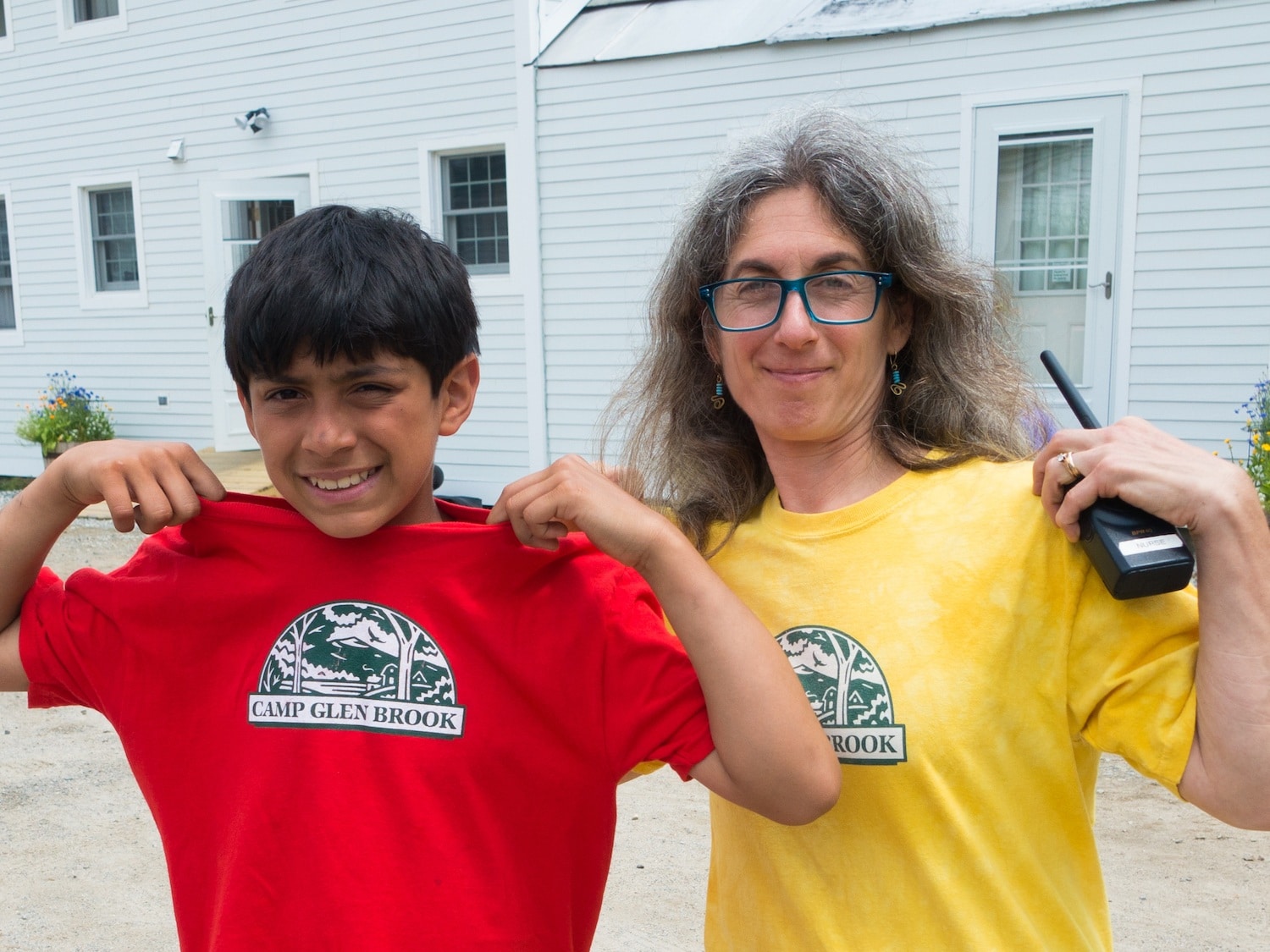Nurse Katy and a camper proudly display their Camp Glen Brook Glen-wear