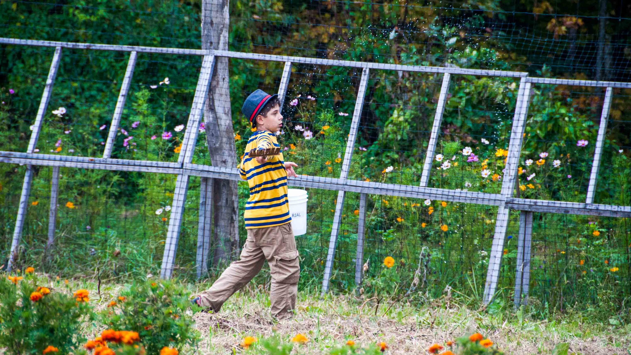 A camper watering the garden