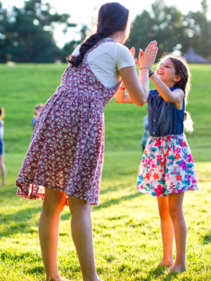 A camper and a family member having fun together.