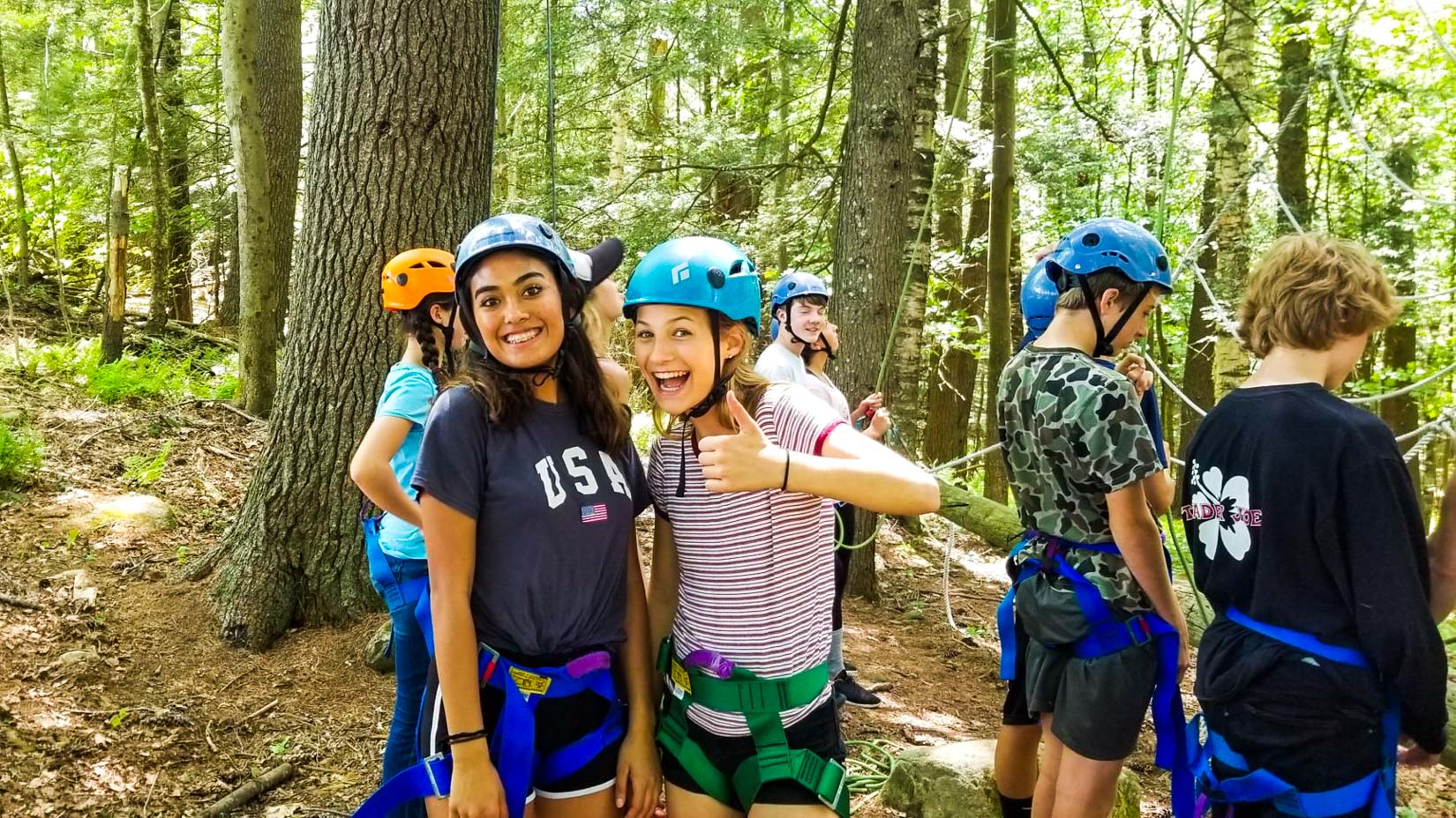 Counselors learning how to rock climb