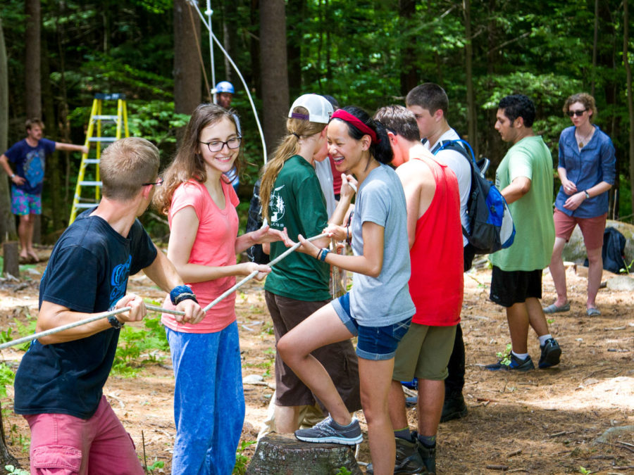 Campers getting ready for high ropes course adventures.