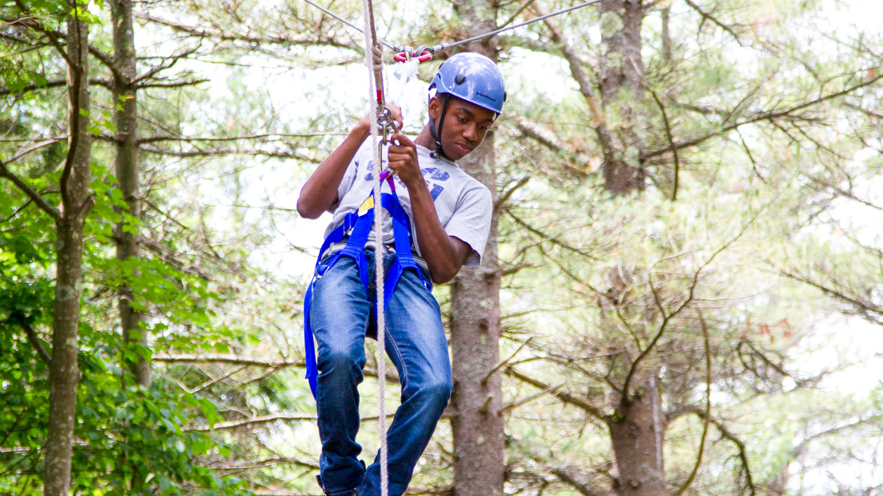 A camper on the high ropes course.