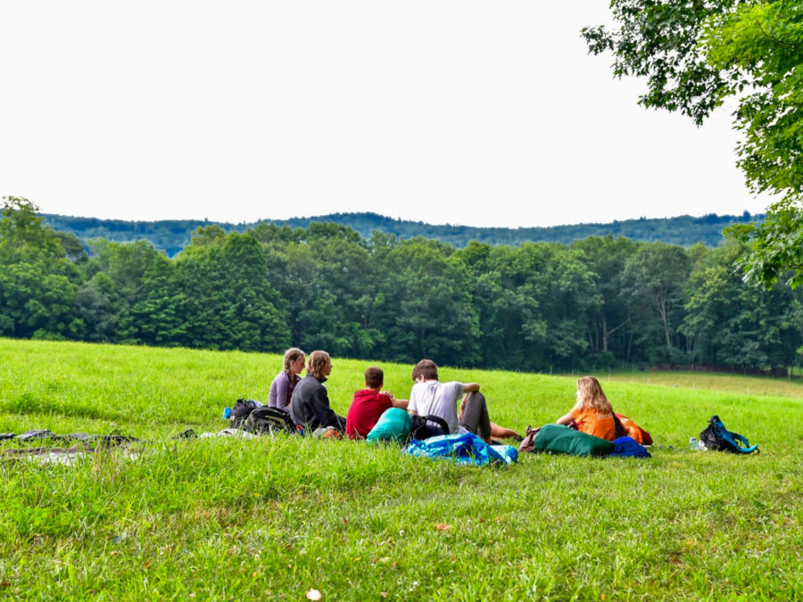 Campers lounging on the grass