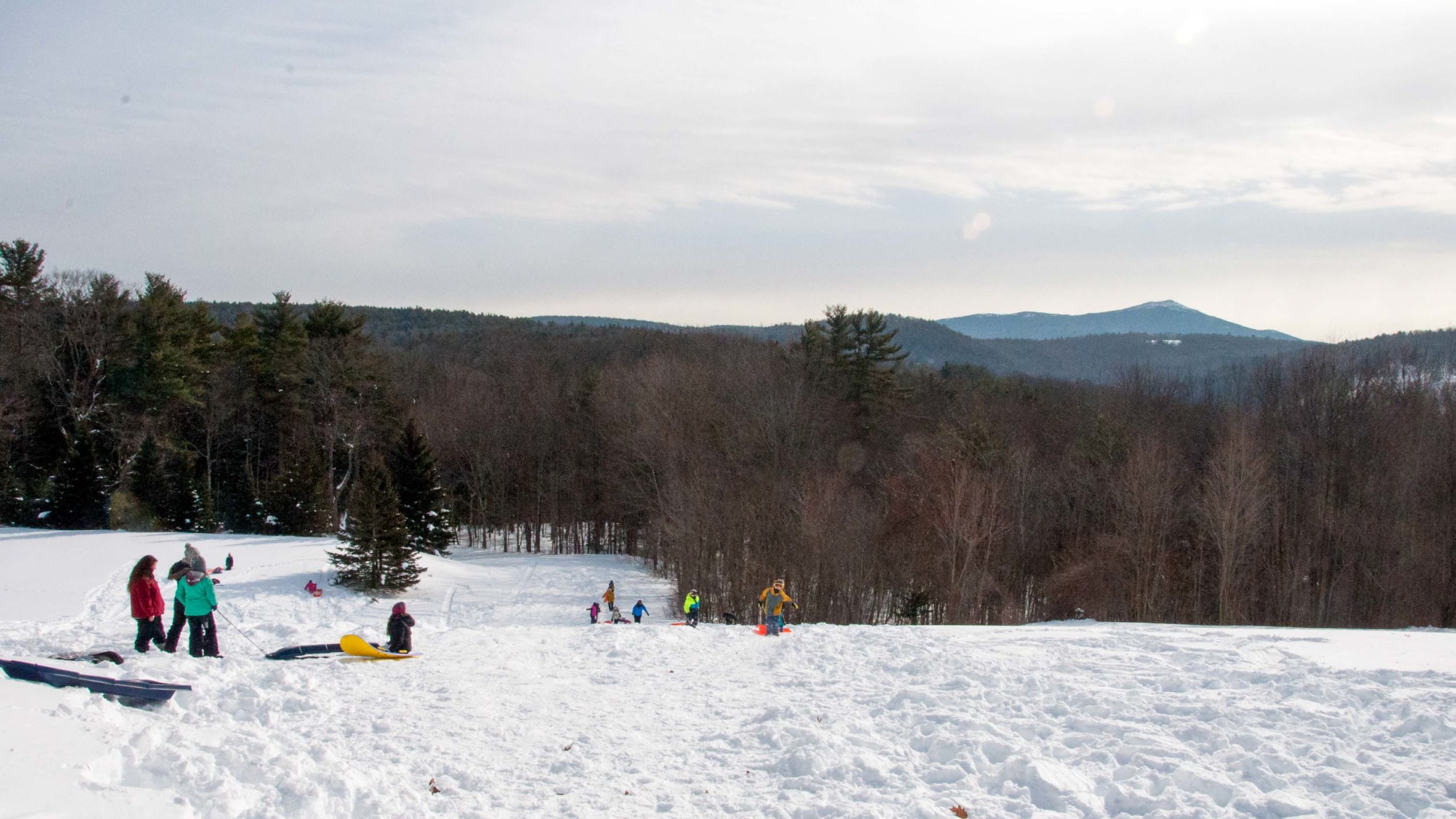 Campers playing in the snow.