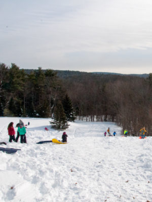 Campers playing in the snow.